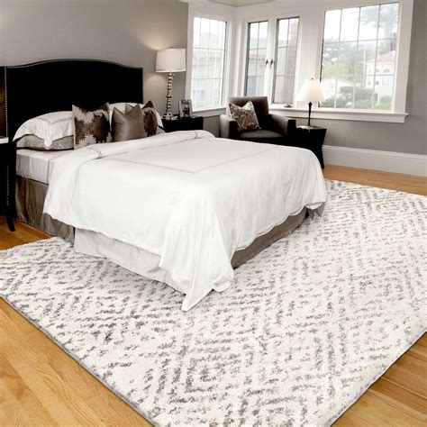 area rug over cheap carpet in bedroom
